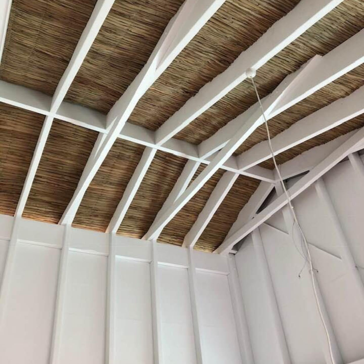 Palm Fibre and White Exposed Beams Ceiling