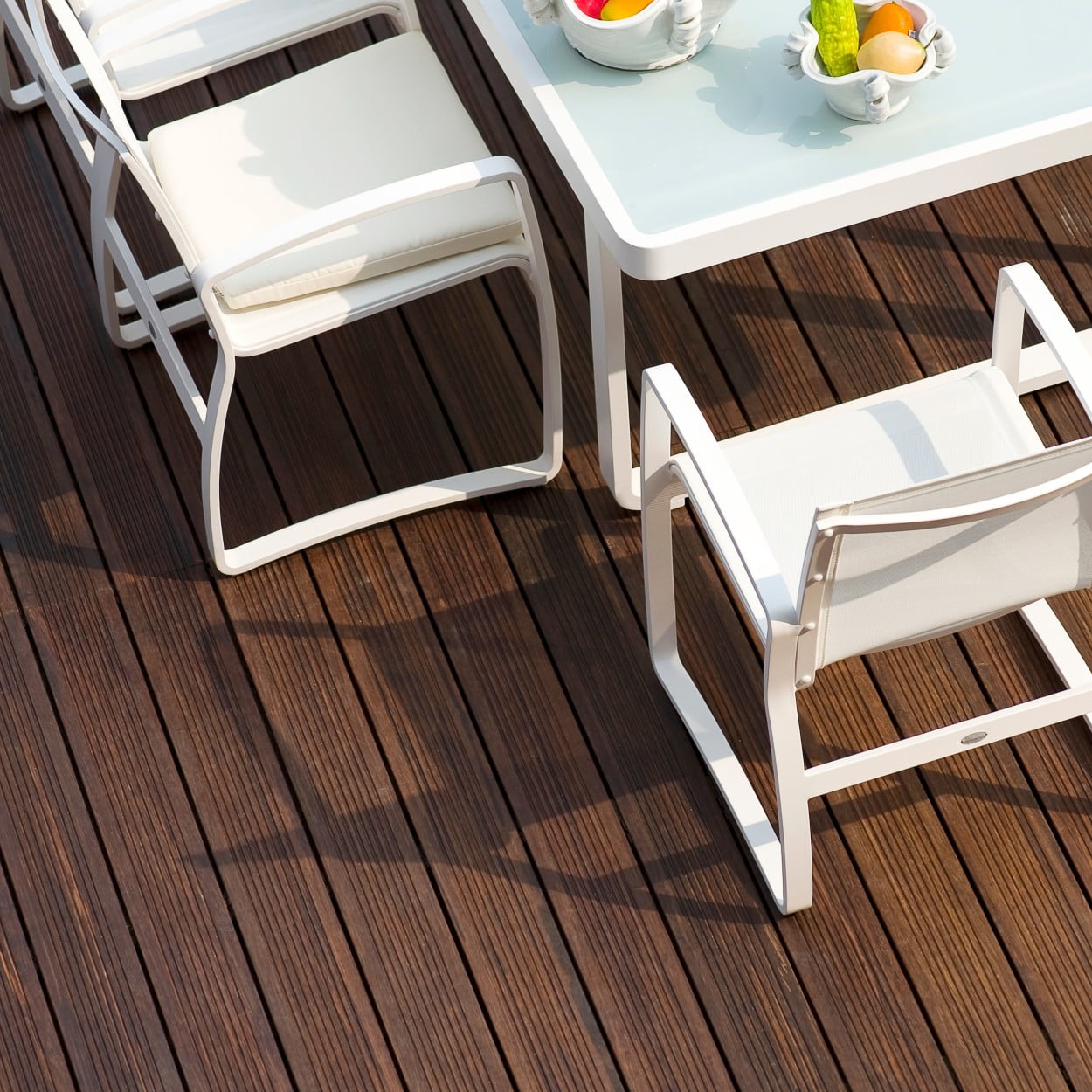 Bamboo Decking With White Chairs and Table