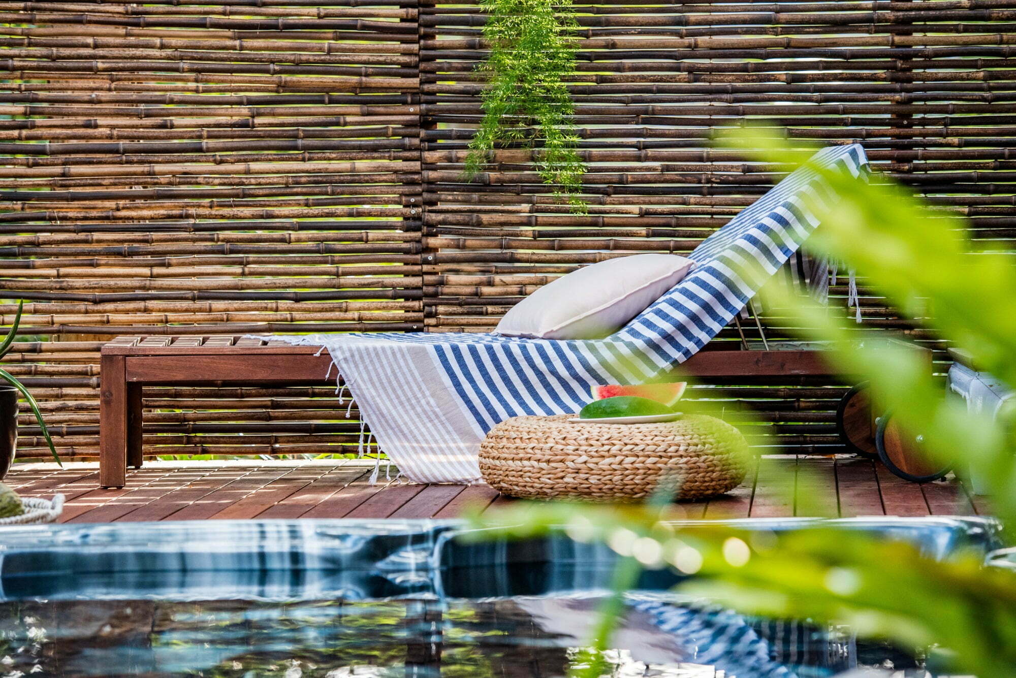 Black Bamboo Screen Behind Deckchair