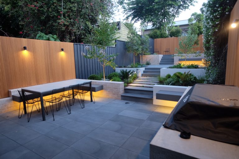 Contemporary Backyard Clad in Bamboo Slatted Screens